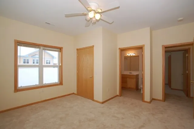 Lower-level living room with corner fireplace