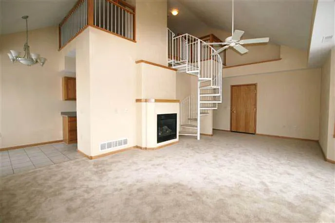 Bright living room with fireplace in an upper-level penthouse